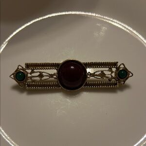 Elegant Gold and Green Brooch